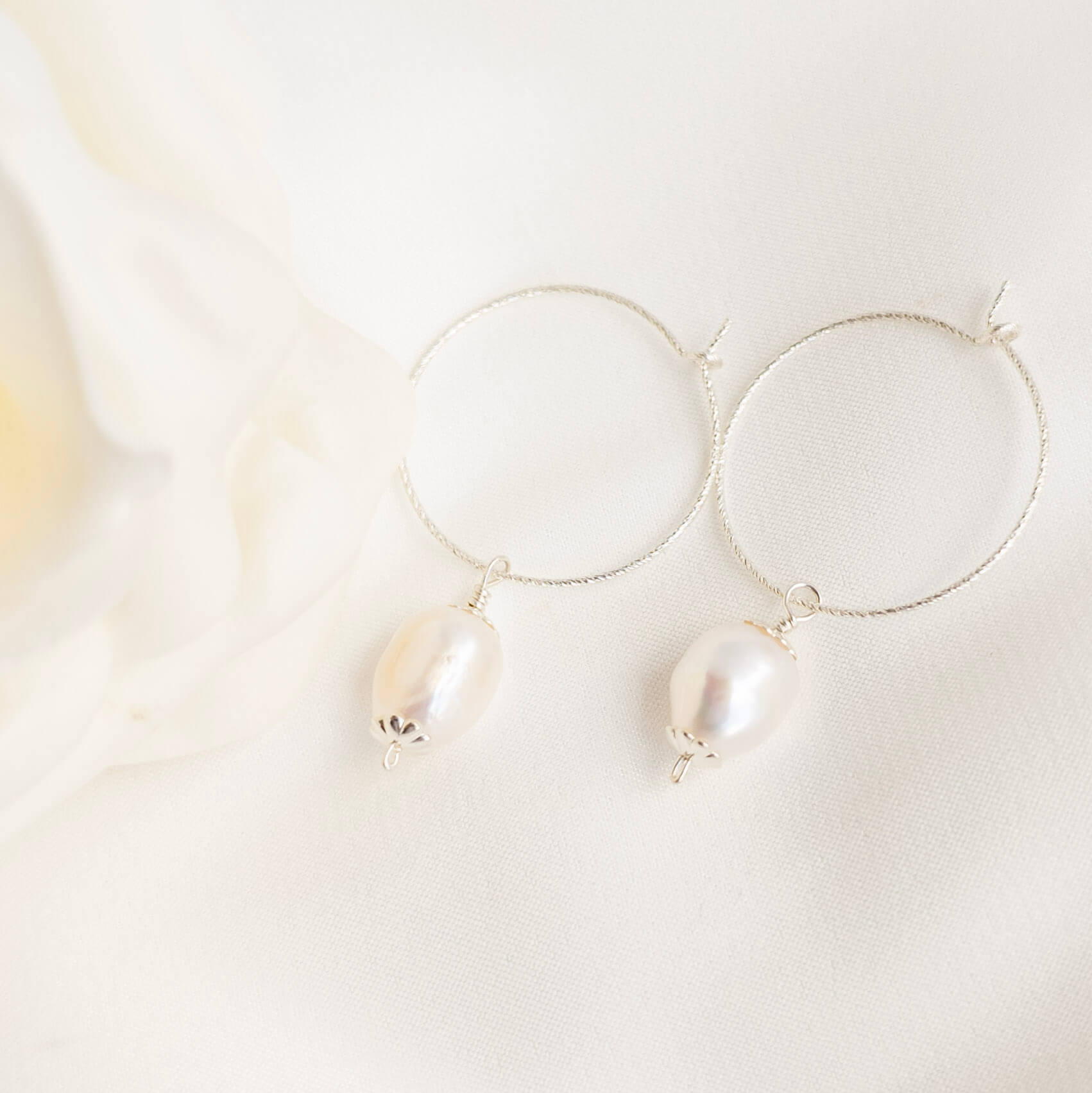 Silver hoop earrings with vintage style pearl