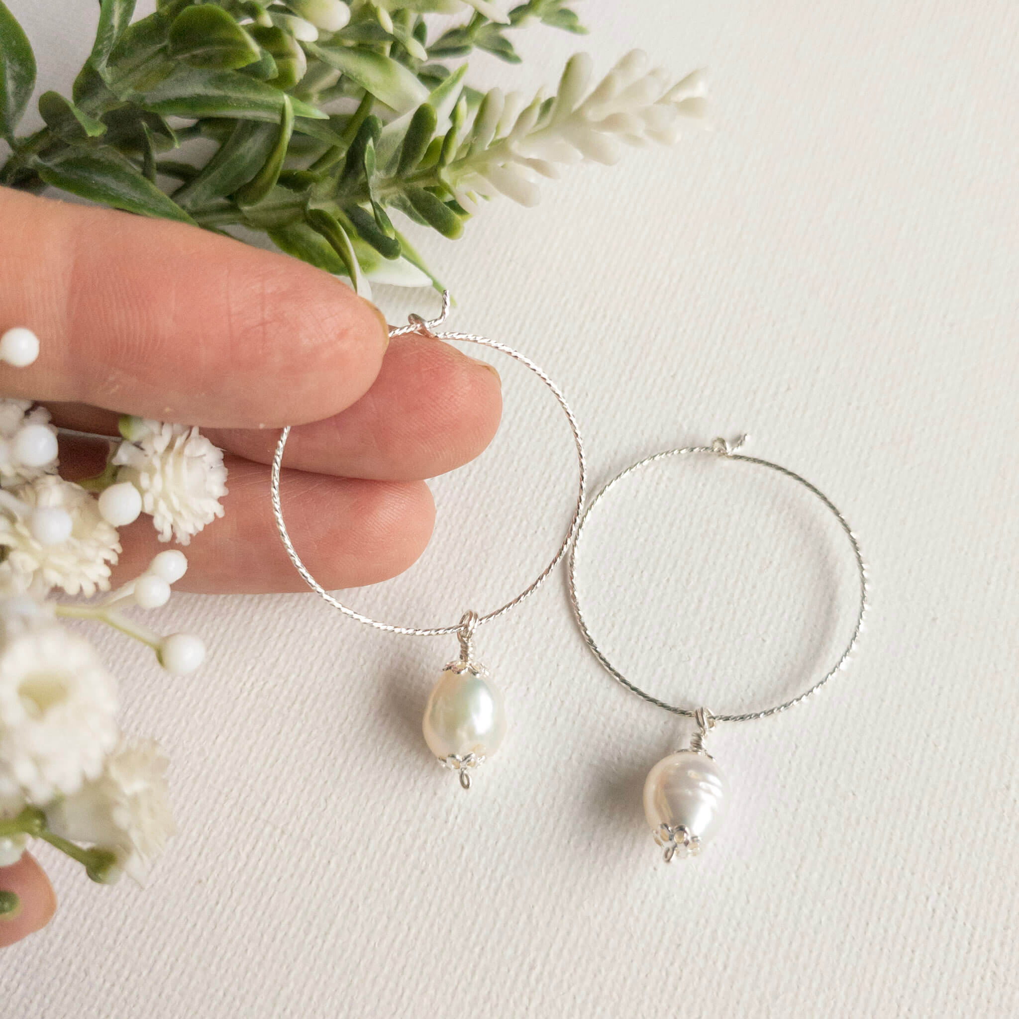 Silver hoop earrings with vintage style pearl