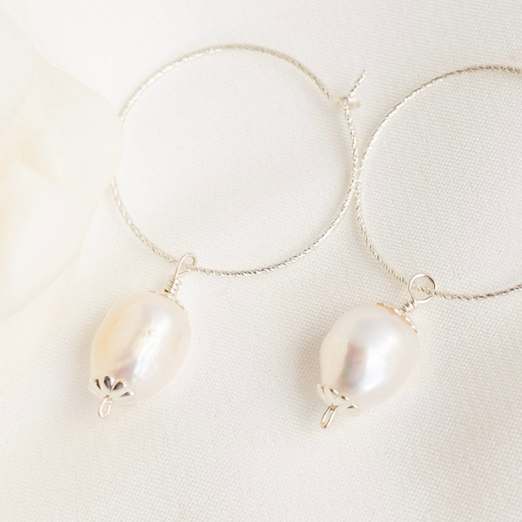 Silver hoop earrings with vintage style pearl