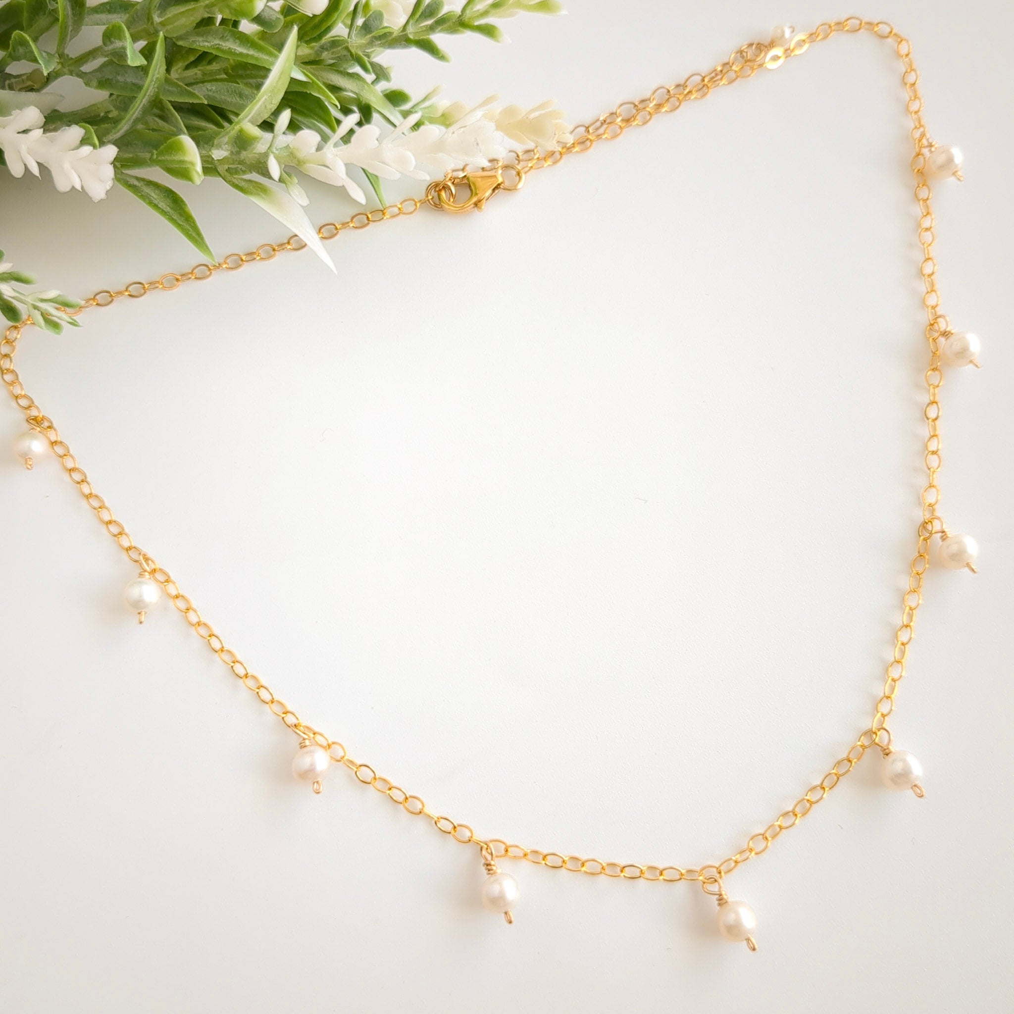 Gold chain necklace with pearl drops