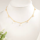 Gold chain necklace with pearl drops