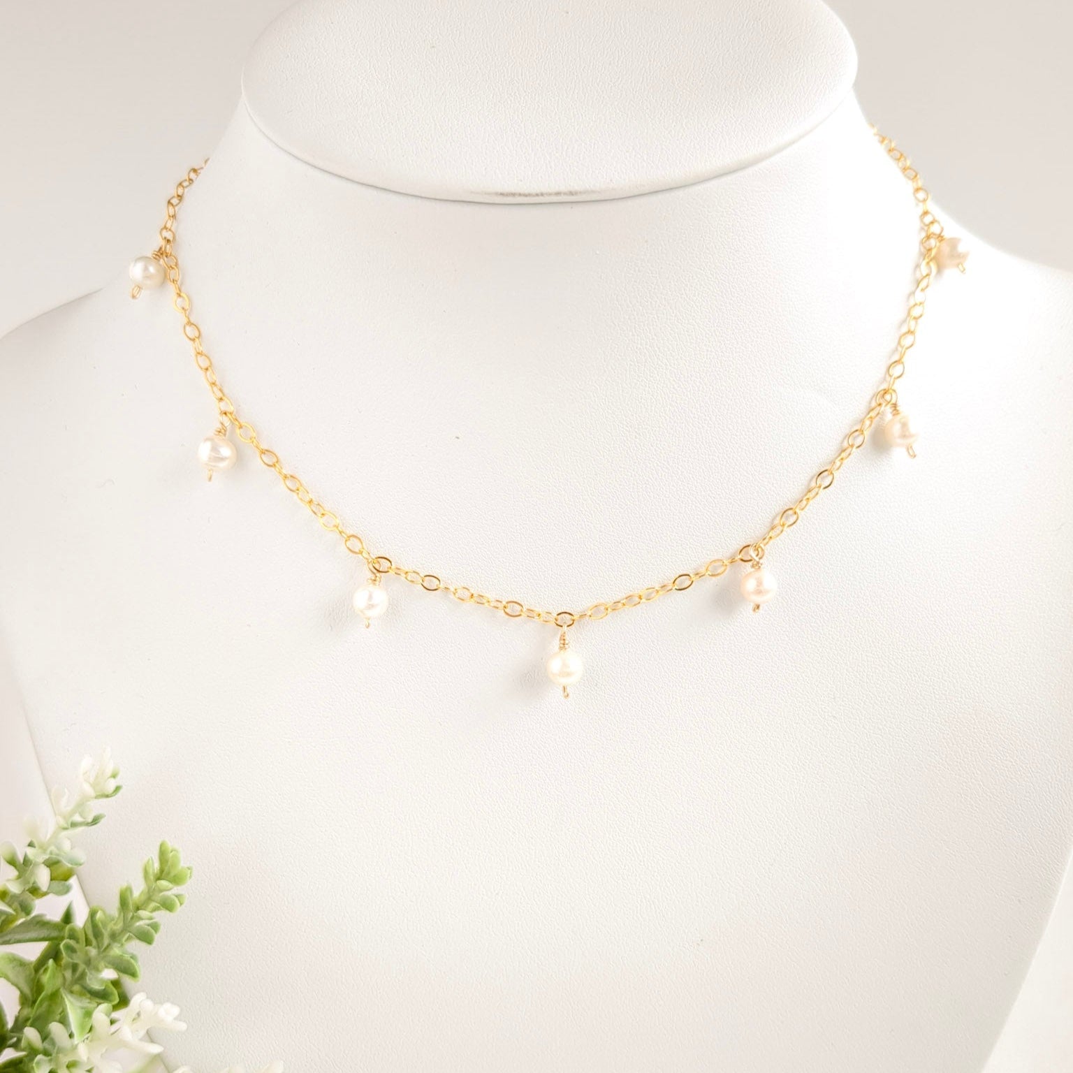 Gold chain necklace with pearl drops
