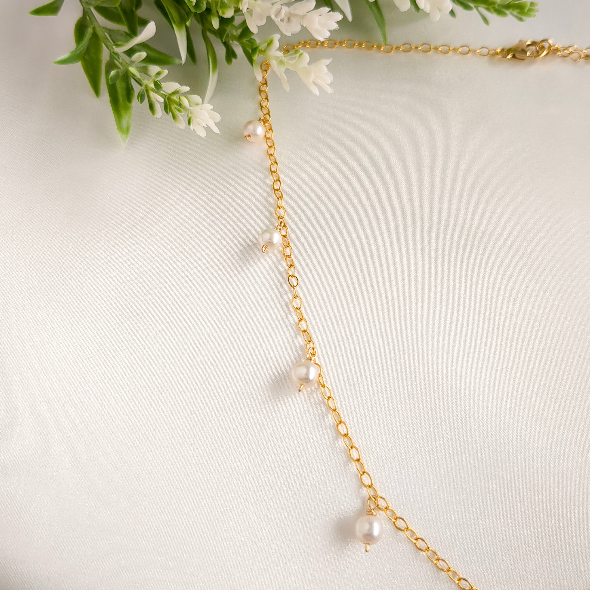 Gold chain necklace with pearl drops