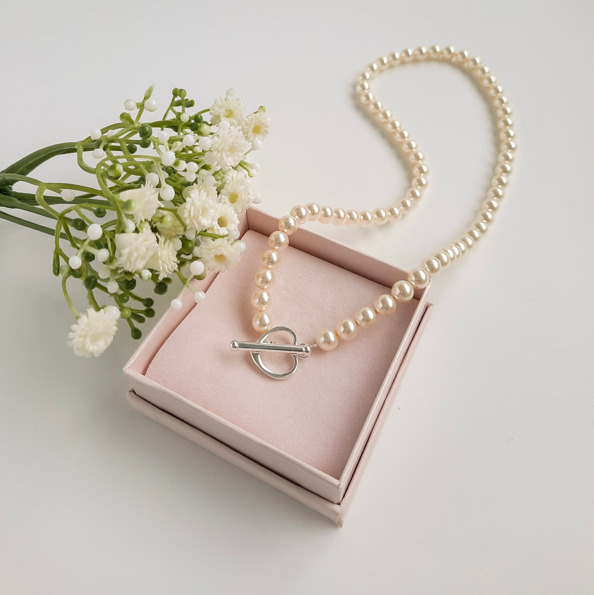 Pearl necklace with heart clasp