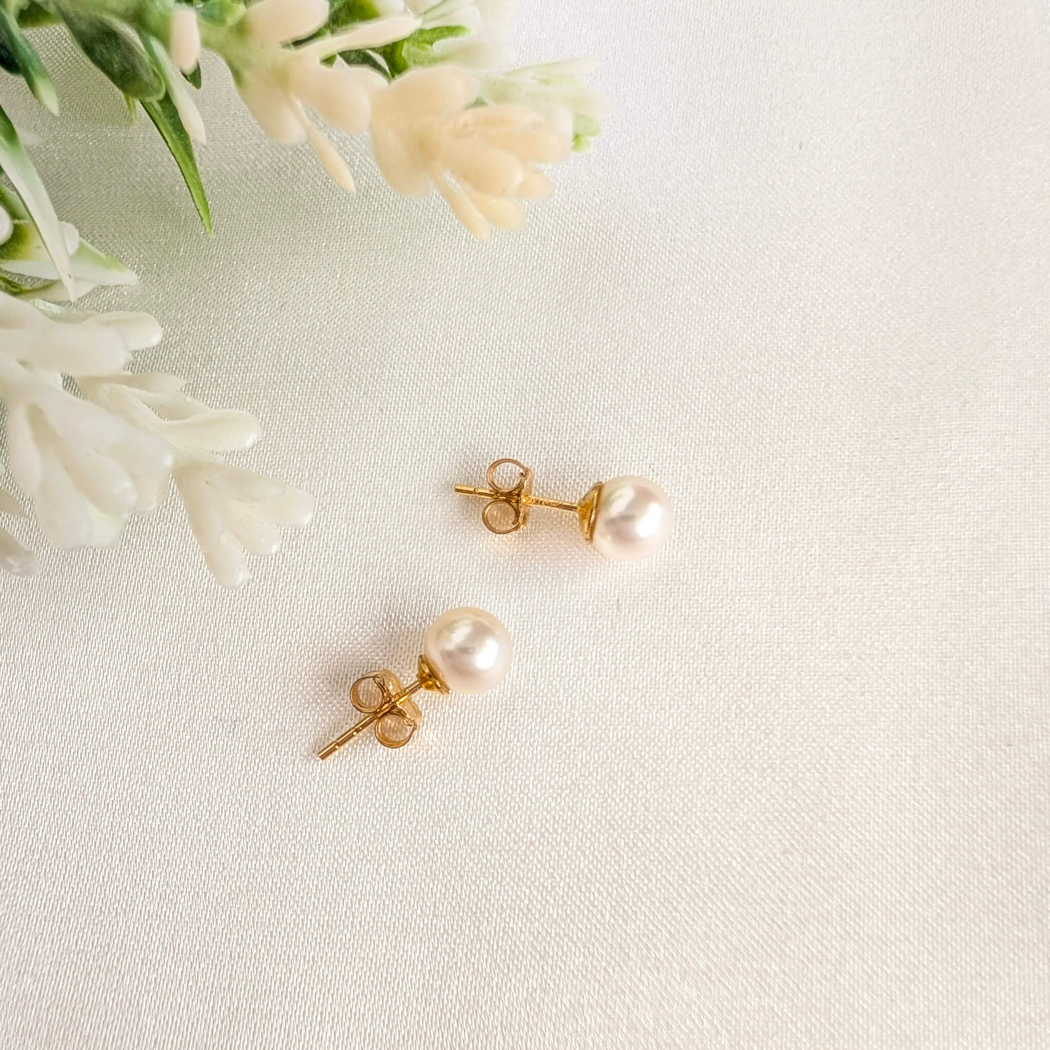 medium sized pearl stud earrings in gold