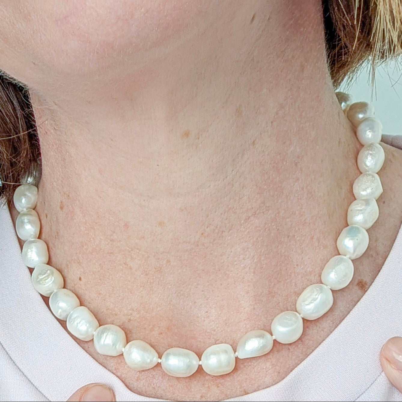 Chunky relaxed pearl necklace worn on neck