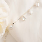 Pearl bracelet on a soft white background
