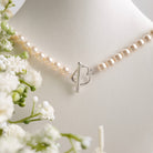 Pearl necklace with heart clasp