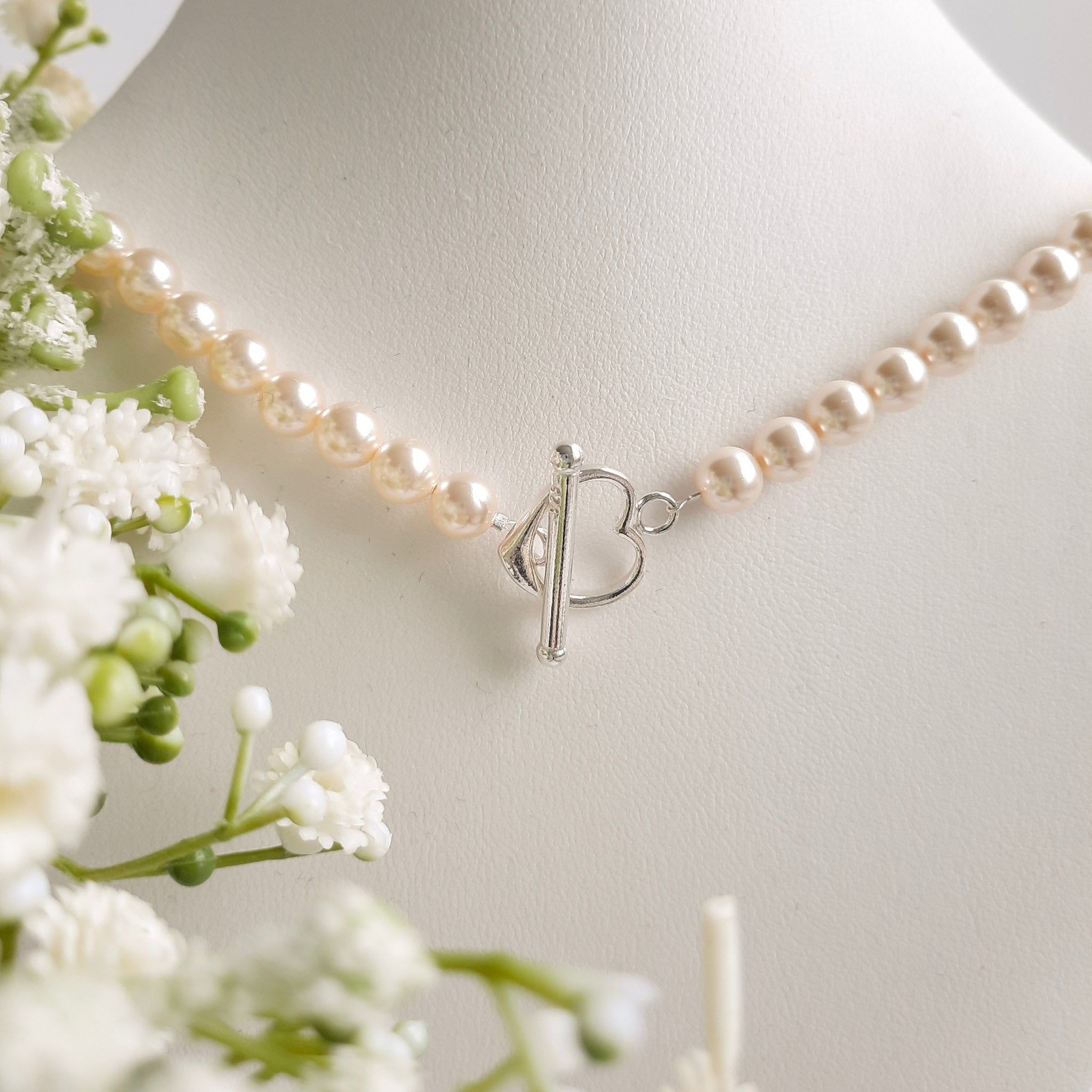 Pearl necklace with heart clasp