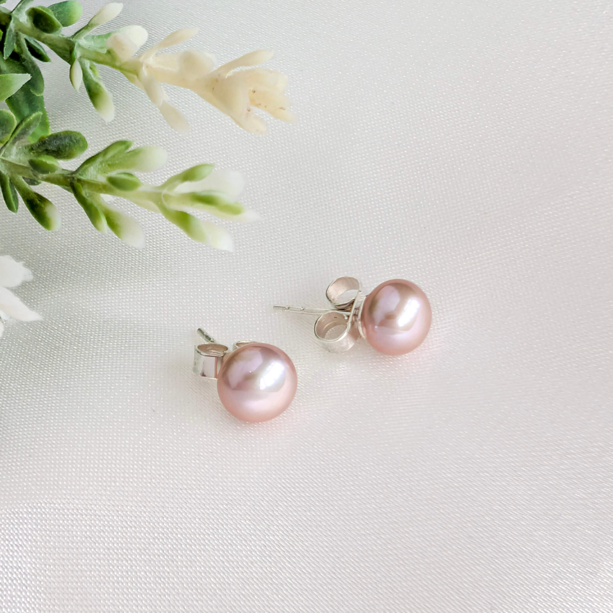 Pink pearl stud earrings