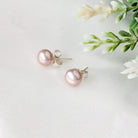 Pink pearl stud earrings