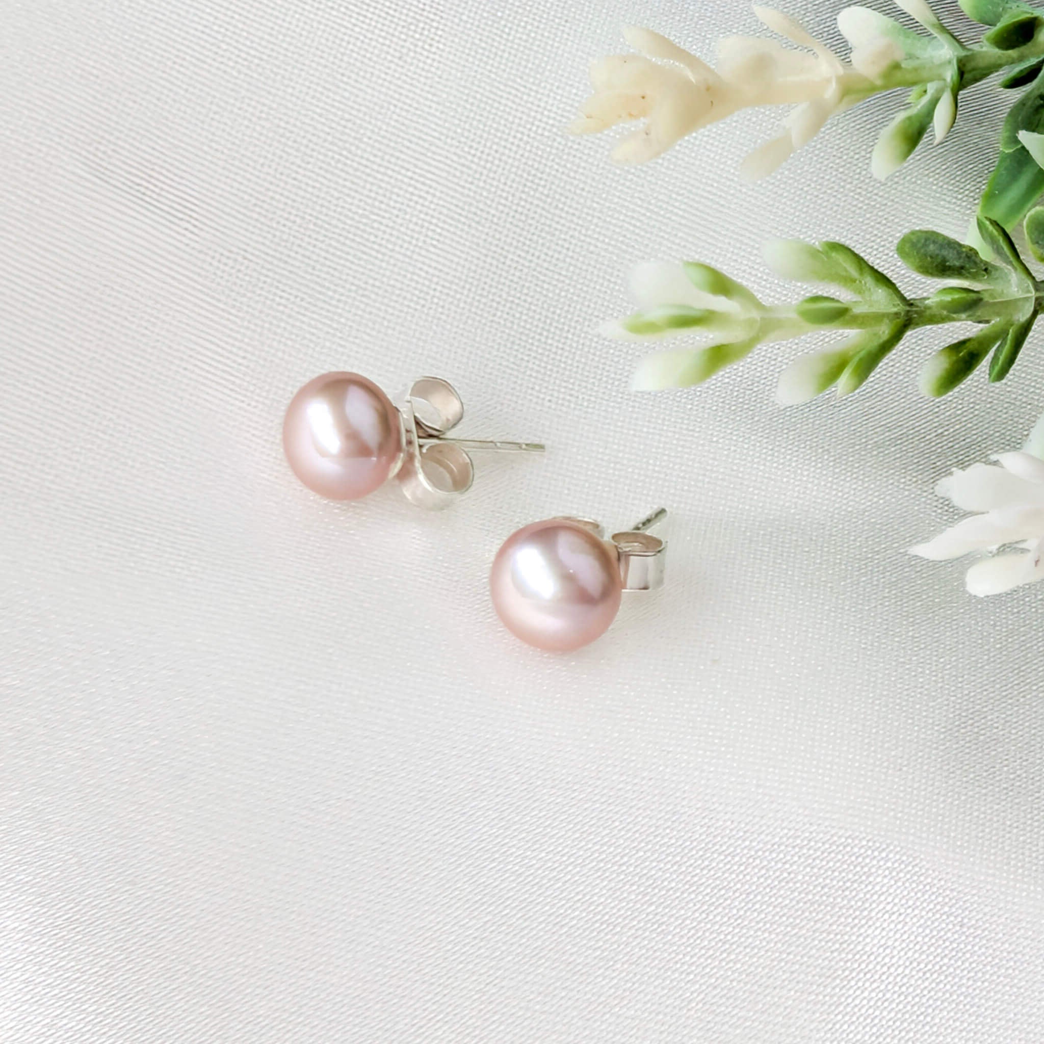Pink pearl stud earrings