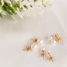 Pearl Stud earrings in Gold in small, medium and large pearl sizes.